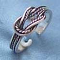 stamped 925, sterling silver ring with rope pattern and know design