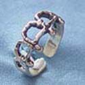 sterling silver ring with thick band design and twist line forming in letter "A" pattern