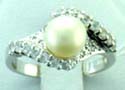 sterling silver ring with curve shape and mini white cz embedded white pearl in the center