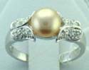 a brown pearl with a cz flower on each side design sterling silver ring