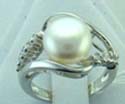 sterling silver thin band ring with diamond shape holding a white pearl