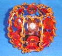 a jar shape candle holder with light orange beads