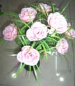 a bouquet of light pink rose with grass together